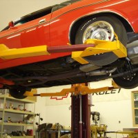 Mohawk vehicle lift shown with wheel adaptors